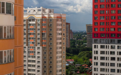 How do housing cooperatives differ from condominiums?