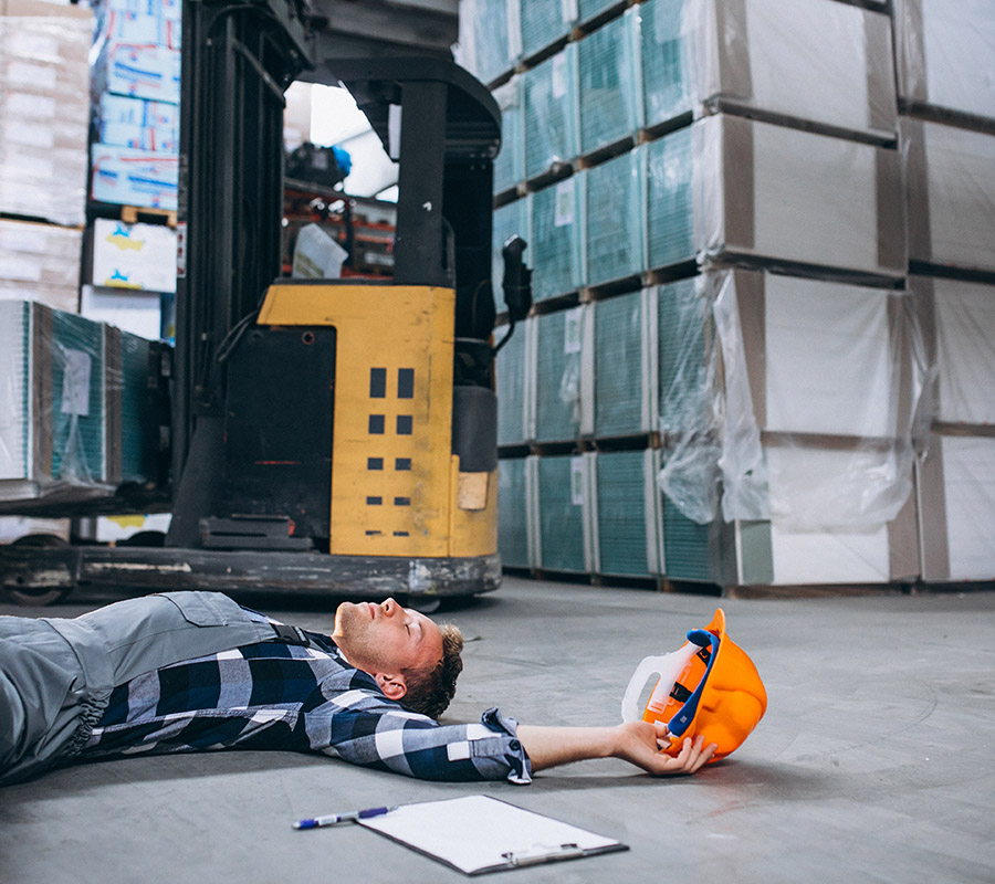 An accident at a warehouse, man on floor